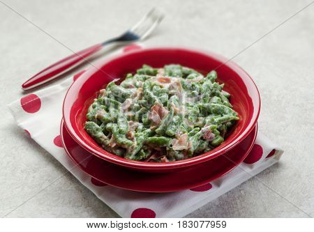 spatzli gnocchi with speck, selective focus 