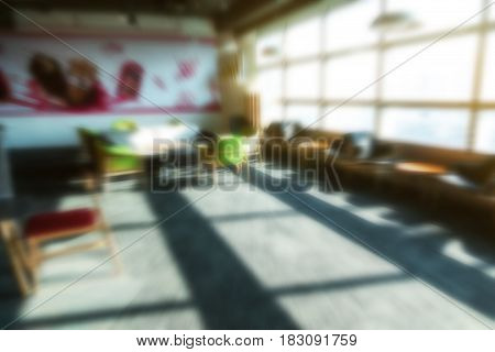 blur office background coffee break area with resting comfortable chair coffee maker fridge taken indoor in morning with sun shining from window for luxury urban office space dream office interio