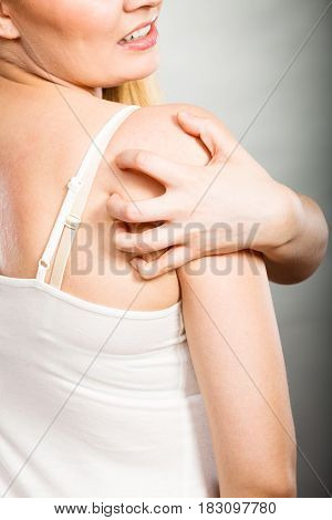 Woman Scratching Her Itchy Back With Allergy Rash