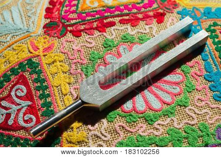 tuning fork and crystal on table .