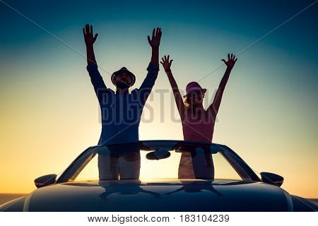 Silhouette Of Happy Couple At The Beach