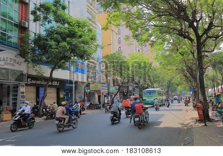 HO CHI MINH CITY VIETNAM - NOVEMBER 26, 2016: Unidentified people drive on Pham Ngu Lao street. Pham Ngu Lao street is a famous backpacker street.