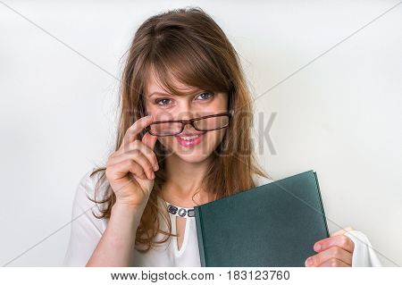 Happy Graduate Woman With Her Dissertation Work On White