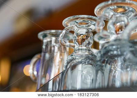 Closeup of emplty glasses with handles in restaurant