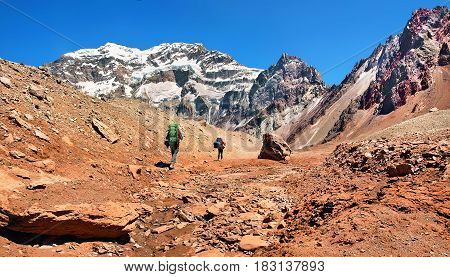 Hikers on their way to Aconcagua as seen in the background Aconcagua National Park, Argentina, South America