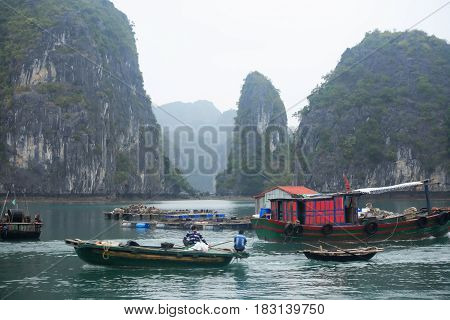 Halong Bay Vietnam - March 7 2017: fishingl boats near Cat Ba island Halong Bay Vietnam