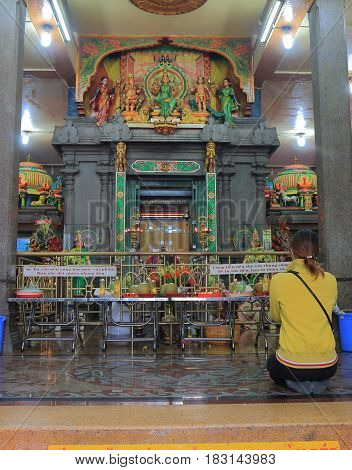HO CHI MINH CITY VIETNAM - NOVEMBER 26, 2016: Unidentified people pray at Mariamman temple. Mariamman temple is a temple dedicated to the Hindu goddess Mariamman built in the late 19th century.
