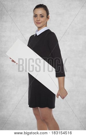Beautiful Girl Holding A Blank Billboard At Hand