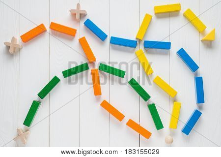 Choosing the right path. Business background the concept of logical thinking. The choice of the right path from the four roads is green orange blue and yellow the top view flat lay.