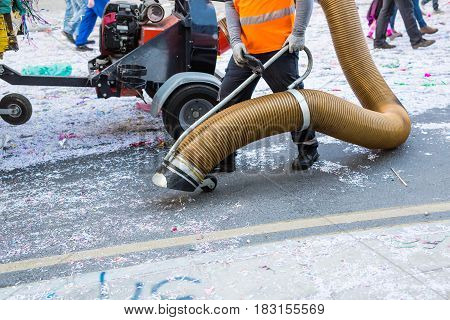 Street cleaner with industrial vacuum cleaner. Municipal cleaning service, clean streets