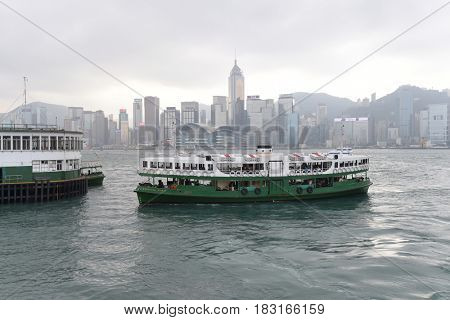 HONG KONG - JANUARY 9 2016: Star Ferry leaving Central pier on JANUARY 9 2016: in Hong Kong, China. Star ferry is in operation in Victoria harbor for more than 120 years.