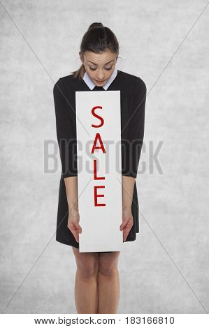 Surprised Woman Looks At An Sale Word