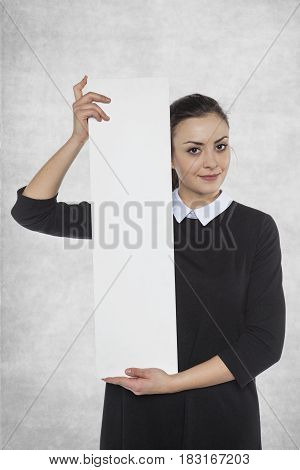 Beautiful Woman Holding A Blank Billboard, Space For Advertising