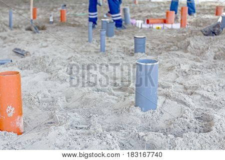 Arranged PVC of water pipes are assembled and lined up on building site.