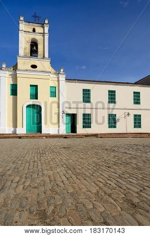 Facade of the colonial Saint John of God Church (Iglesia de San Juan de Dios) church by the San Juan de Dios square in the Camaguey town on Cuba