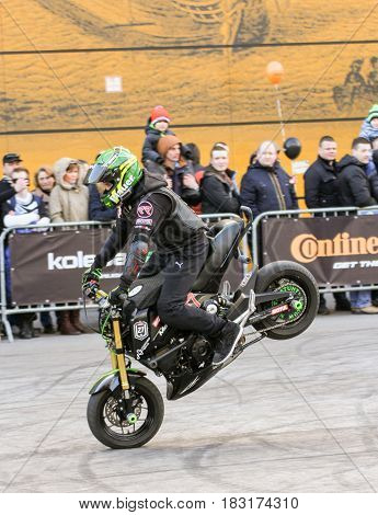 St. Petersburg Russia - 15 April, Front wheel braking,15 April, 2017.
International Motor Show IMIS-2017 in Expoforurum.
Sports motorcycle show of bikers on the open area.