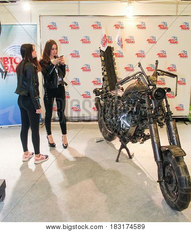 St. Petersburg Russia - 15 April, Young girls at moto concept,15 April, 2017.
International Motor Show IMIS-2017 in Expoforurum.
Visitors and participants of the annual moto-salon in St. Petersburg.