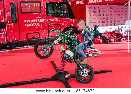 St. Petersburg Russia - 15 April, Teenager on a spring motobike,15 April, 2017.
International Motor Show IMIS-2017 in Expoforurum.
Visitors and participants of the annual moto-salon in St. Petersburg.