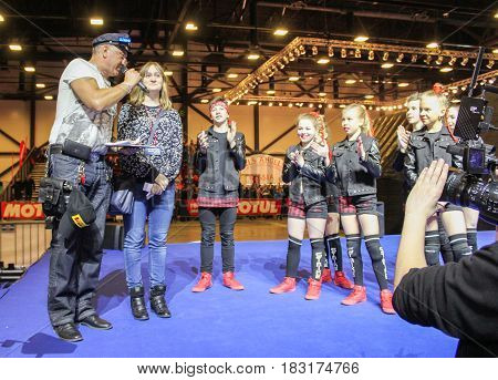 St. Petersburg Russia - 15 April, An elderly entertainer with a group of teenagers,15 April, 2017.
International Motor Show IMIS-2017 in Expoforurum.
Dance show group of teenagers in the style of hip-hop.