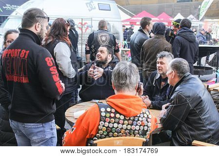 St. Petersburg Russia - 15 April, People on the street at the table,15 April, 2017.
International Motor Show IMIS-2017 in Expoforurum.
Visitors and participants of the annual moto-salon in St. Petersburg.