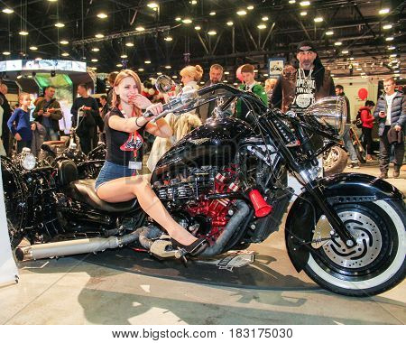 St. Petersburg Russia - 15 April, Girl on a moto monster,15 April, 2017.
International Motor Show IMIS-2017 in Expoforurum.
Models on motorcycles presented at the motor show.