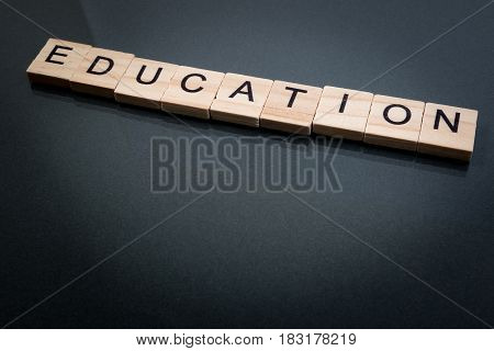 Wood Block Education Word Over Backboard School. Education Word Formed By Educational Wood Block. Ed
