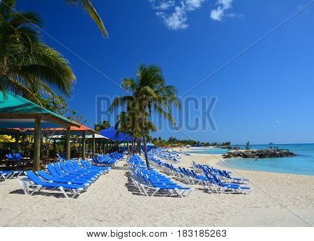 Blue sunbeds on beautiful beach. Eleuthera island Bahamas