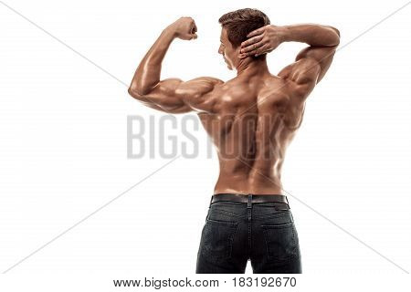Strong Athletic Man Fitness Model posing back muscles, triceps over white background. Copy space. Isolated on white background.