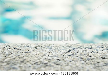 Whets stone and blue abstract background swimming pool