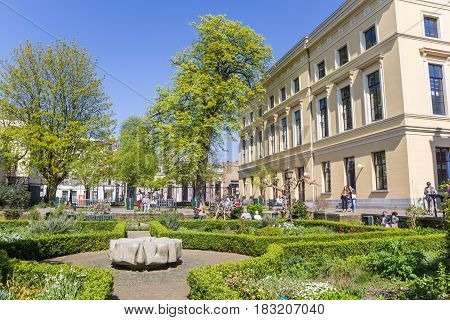 UTRECHT, NETHERLANDS - APRIL 09, 2017: People enjoying the sun in Pandhof Sinte Marie in Utrecht, Holland