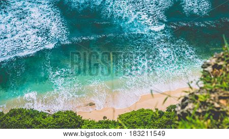 Top Aerial view of Nunggalan Beach near Uluwatu, Bali, Indonesia.