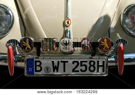 BERLIN - MAY 28: Signs of communities Volkswagen Beetle on the hood the exhibition 