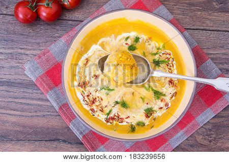 Pumpkin puree with saffron and meatballs. Studio Photo