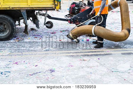 Street cleaner with industrial vacuum cleaner. Municipal cleaning service, clean streets