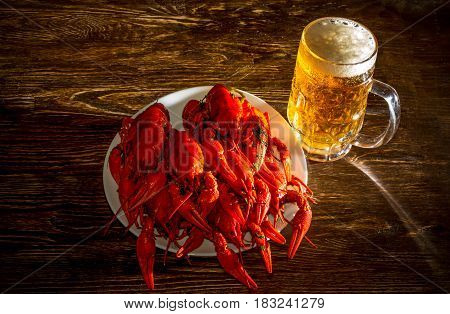Plate With Boiled Crawfish And A Glass Of Beer