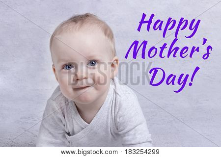 Happy mothers day. Cute baby boy congatulates his mother.