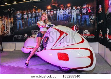St. Petersburg Russia - 15 April, The girl behind the wheel of a moto-concept,15 April, 2017.
International Motor Show IMIS-2017 in Expoforurum.
Models on motorcycles presented at the motor show.