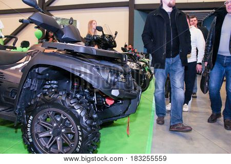 St. Petersburg Russia - 15 April, People walk along a row of ATVs,15 April, 2017.
International Motor Show IMIS-2017 in Expoforurum.
Visitors and participants of the annual moto-salon in St. Petersburg.
