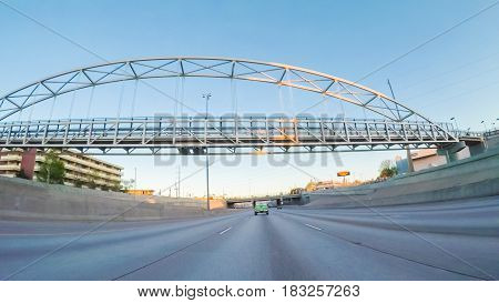 Denver Colorado USA-April 22 2017. POV point of view -Driving South in Interstate highway I25 at sunset.