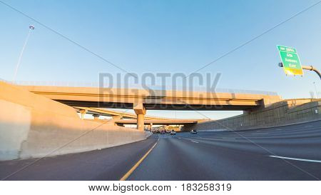 Denver Colorado USA-April 22 2017. POV point of view -Driving South in Interstate highway I25 at sunset.