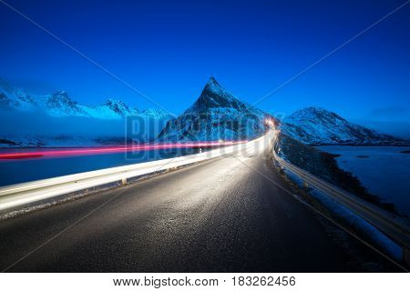 Olstind Mount and car light. Lofoten islands? spring time, Norway