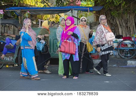 Yogyakarta, Indonesia - september 15, 2015: Colorful Indonesian moslim women walking at the streets of Yogyakarta, Indonesia