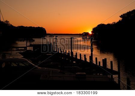 The sun setting by the St. Johns' River in Jacksonville, FL