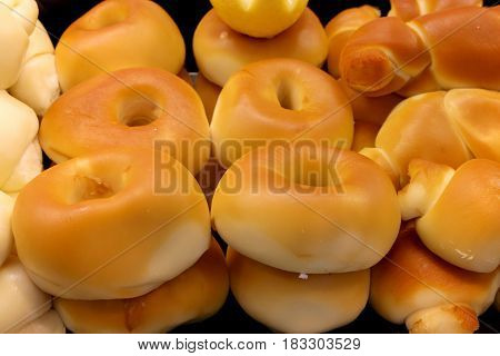 Block of italian cheese. Provola and provolone, shaped wheels.