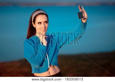 Cute Girl In Sportswear Outfit Taking a Selfie