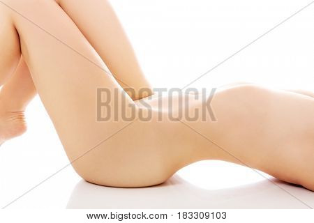 Nude woman lying on the floor