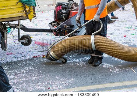 Street cleaner with industrial vacuum cleaner. Municipal cleaning service, clean streets