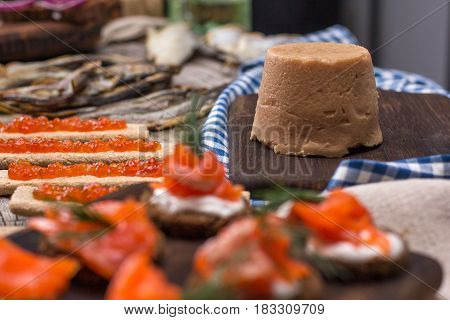 Still life - traditional Norwegian cuisine - Brunost and fish
