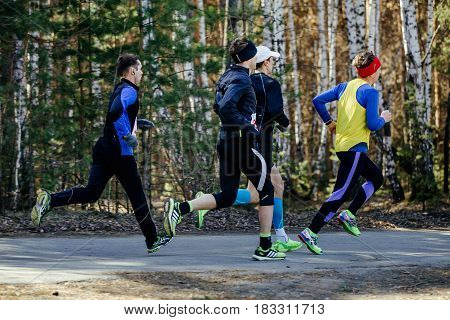 Chelyabinsk Russia - April 22 2017: group runners men running on asphalt road during Spring half marathon