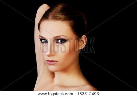 Attractive blonde topless woman with dark make up